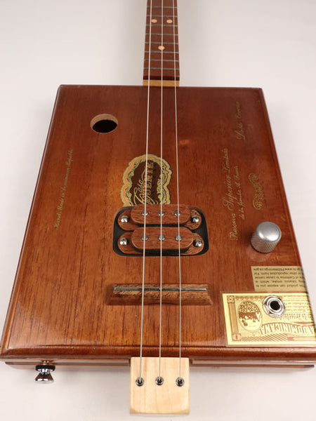 Front view of a Fuente 3 string cigar box guitar made with a maple neck sapele fretboard handmade by Mike Snowden of Snowden Guitars.