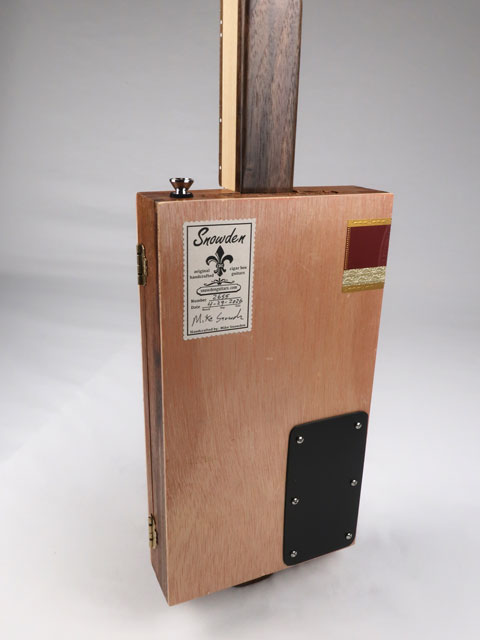 Back view of a cigar box guitar with a Maple neck and Walnut hell. Handmade by Mike Snowden of Snowden Guitars.