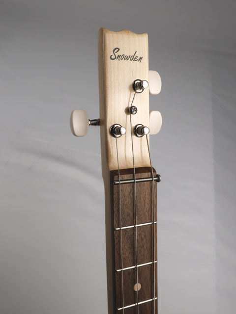 Front view of a 3 string cigar box guitar with a maple neck and walnut fretboard. Snowden Guitars logo is on the front headstock handmade by Mike Snowden.