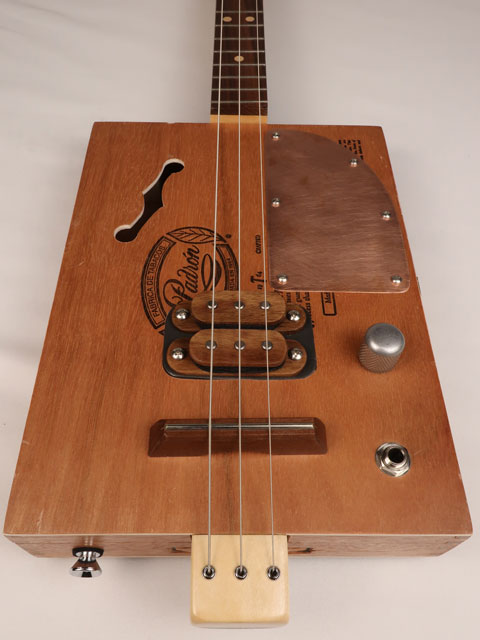Front view of a 3 string cigar box guitar made with a Padron cigar box. Handmade by Mike Snowden of Snowden Guitars.