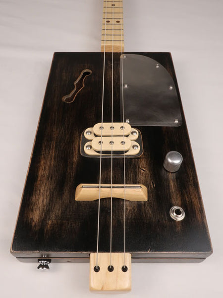 Front view of a 3 string cigar box guitar with a humbucker pickup. Handmade by Mike Snowden of Snowden Guitars.