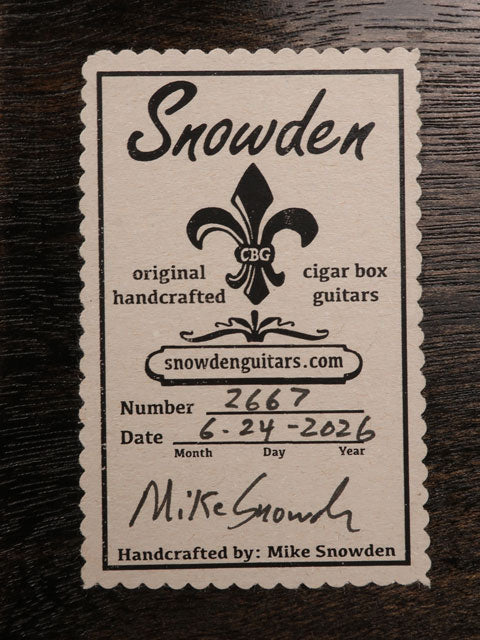 Back view of a cigar box guitar with a Snowden Guitars logo on the back. Handmade by Mike Snowden of Snowden Guitars.