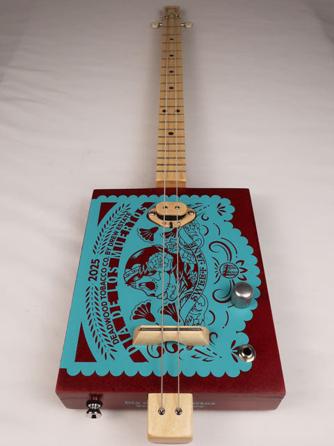 Front view of a 2 string cigar box guitar made with a Sweet Jane cigar box. Handmade by Mike Snowden of Snowden Guitars.