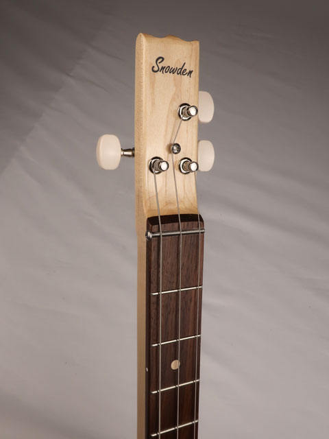 Front view of a 3 string cigar box guitar with a walnut fretboard and maple neck. Snowden guitars logo on the front of the headstock.