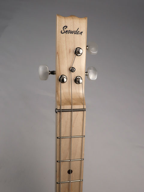 front view of a 3 string cigar box guitar with Snowden logo on the the headstock.