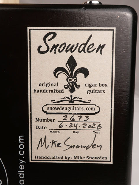 Back view of a cigar box guitar label handmade by Mike Snowden of Snowden Guitars.