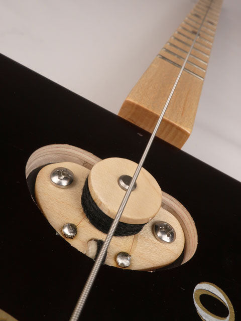 Close up view of a single string cigar box guitar pickup. Single coil one string cigar box guitar pickup. Handmade by Mike Snowden of Snowden Guitars.