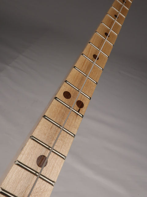 Tilted view of a one string cigar box guitar diddly bow cigar box guitar. Handmade by Mike Snowden of Snowden Guitars.