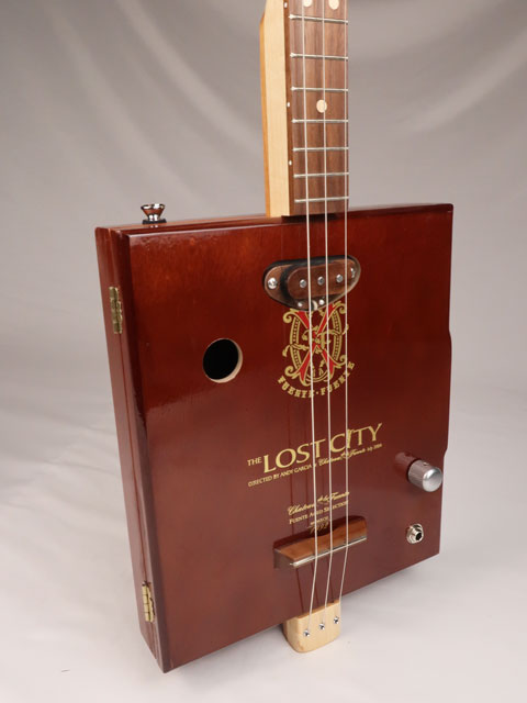 Front view of a 3 string cigar box guitar made with a Lost City Cigar box. Handmade by Mike Snowden of Snowden Guitars.