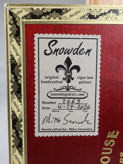 Back view of a cigar box guitar handmade by Mike Snowden. This logo shows the date and number of cigar box guitar is made.