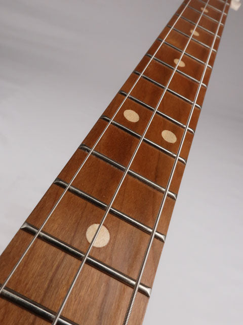 Front view of a 3 string cigar box guitar fret board with cherry wood and maple inlay. This cigar box guitar was made by Mike Snowden of Snowden Guitars.
