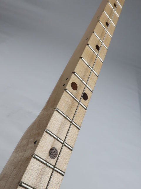 Side view of a cigar box guitar one string diddly bow neck made from maple with walnut inlay. Handmade by Mike Snowden.