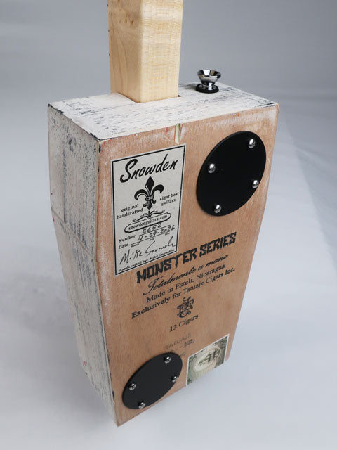 Back tiled view of a coffin shaped cigar box guitar handmade by Mike Snowden.
