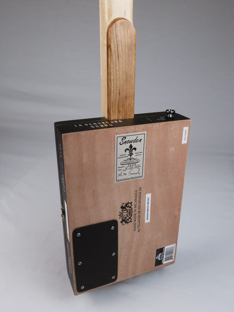 Back view of a cigar box guitar. Maple neck with cherry heal cigar box guitar neck is handmade by Mike Snowden of Snowden Guitars.
