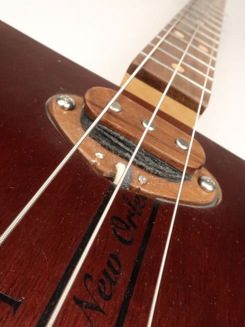 Close up view of a sing coil pickup on a 3 string cigar box guitar. Handmade by Mike Snowden.