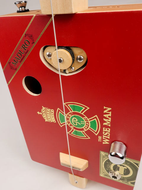 Front view of a one String cigar box guitar diddly bow cbg handmade by Mike Snowden of Snowden Guitars. This cigar box guitar is made with a wise man cigar box.