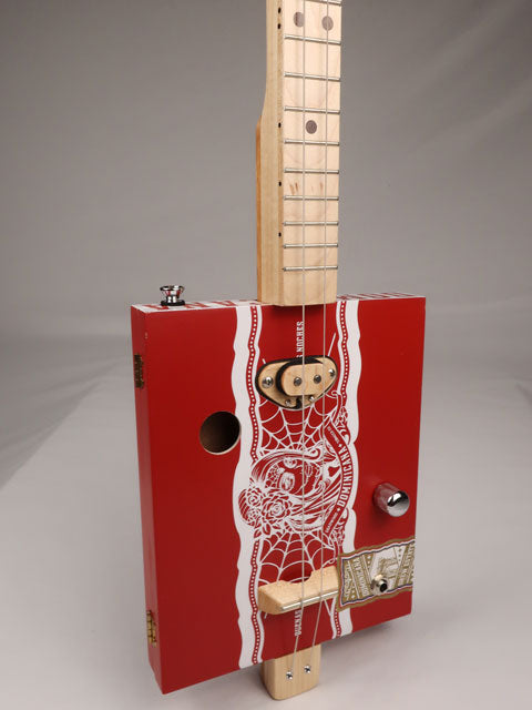 Front tilted view of a 2 string cigar box guitar made with a Deadwood Dominicana cigar box. Handmade by Mike Snowden of Snowden Guitars in Marietta GA USA.