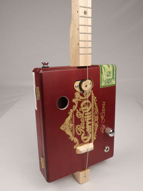 Front view of a one string diddly bow CBG cigar box guitar made with a Perez Carrillo cigar box handmade by Mike Snowden of Snowden Guitars. 