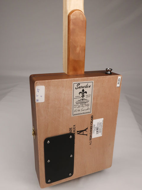 Back view of a 2 string cigar box guitar cbg made with a H. Upmann cigar box. This cigar box guitar was handmade by Mike Snowden of Snowden Guitars.