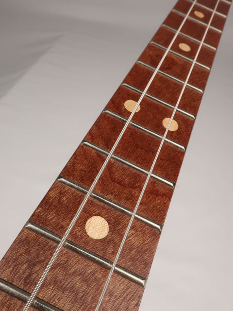 Front view of a cigar box guitar fret board with a Jaime Garcia cigar box. This cigar box guitar is handmade by Mike Snowden of Snowden Guitars.
