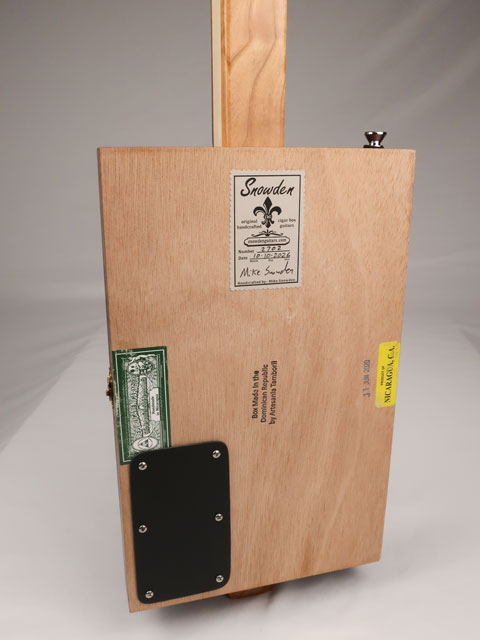 Back view of a 3 string cigar box guitar made with a New Orleans cigar factory cigar box. Handmade by Mike Snowden of Snowden Guitars.