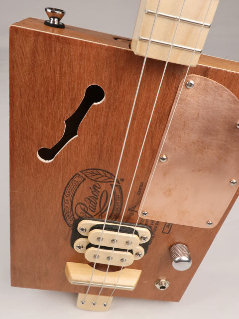 Front view of a 3 string cigar box guitar made with a Padron cigar box. Handmade by Mike Snowden of Snowden Guitars.